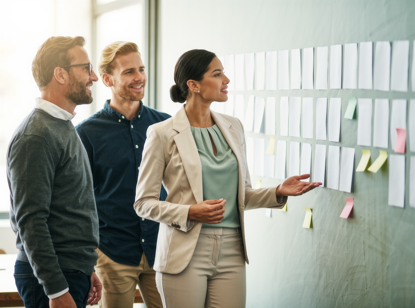 Leadership team discussing priorities at a wall of cards (illustrative image)