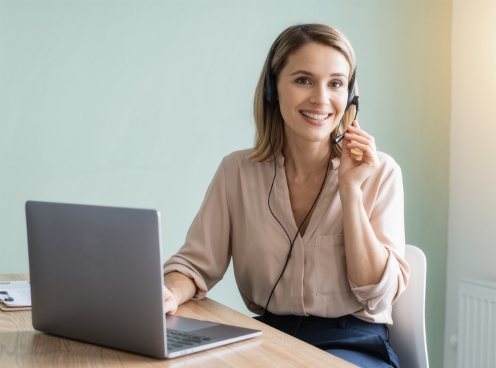 Sales lead on a relaxed phone call at her desk (illustrative image)